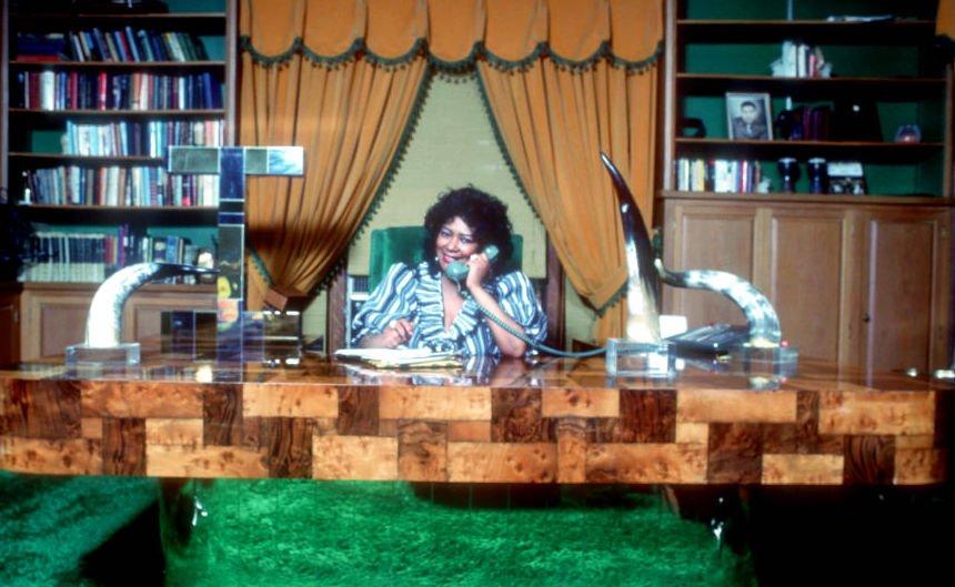 Sylvia Robinson working at desk 1980s